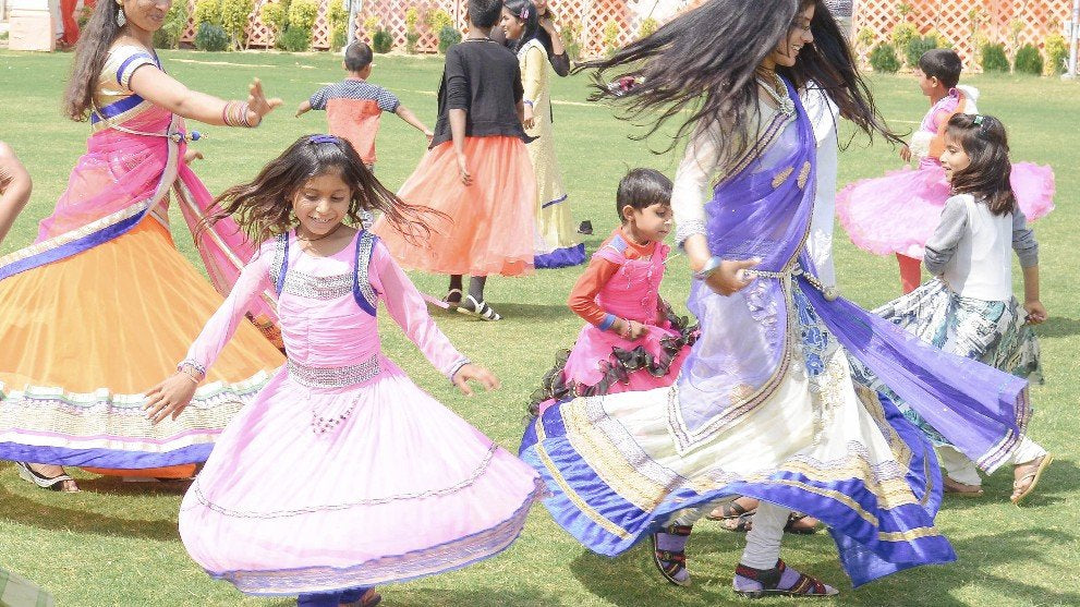Children playing lawn games at the celebration held by Anchal for 300 artisans in Japuir for International Women's Day