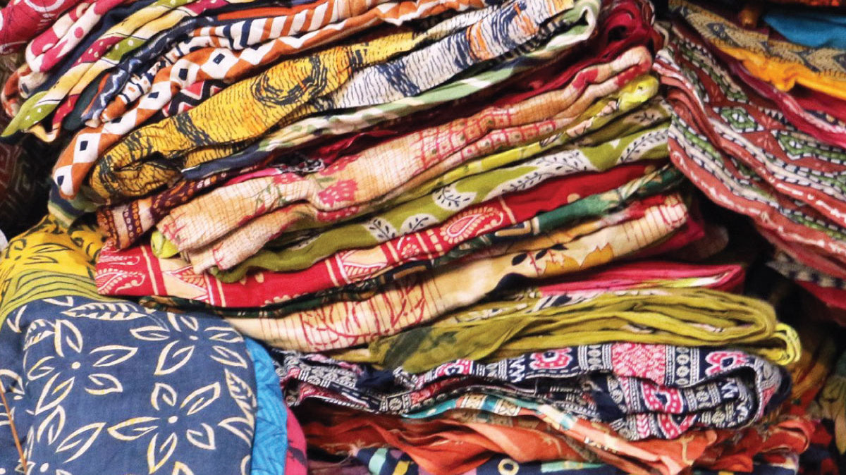Vintage fabrics piled on top of one another, each piece made by hand