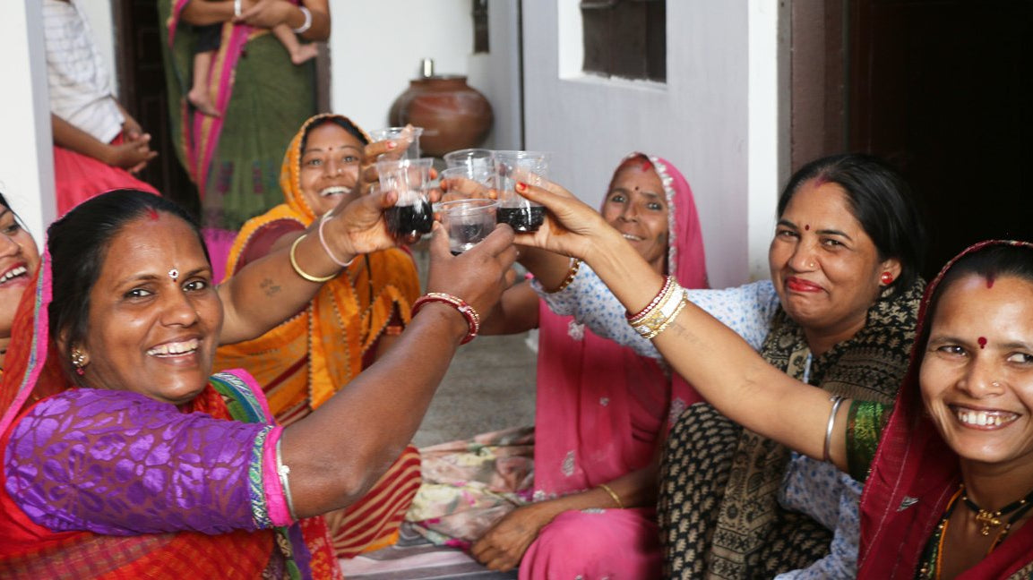 Some of Anchal's artisans celebrating the arrival of the Anchal team by welcoming them into their own homes