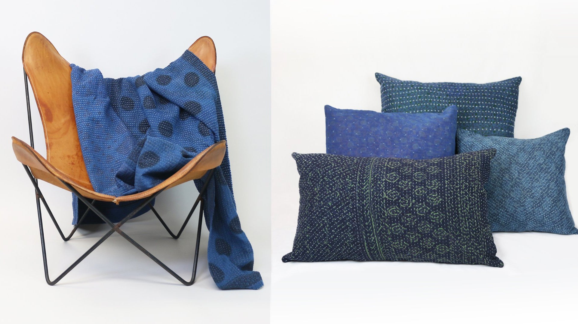 Anchal's naturally dyed indigo throw draped over a chair and four naturally dyed indigo pillows