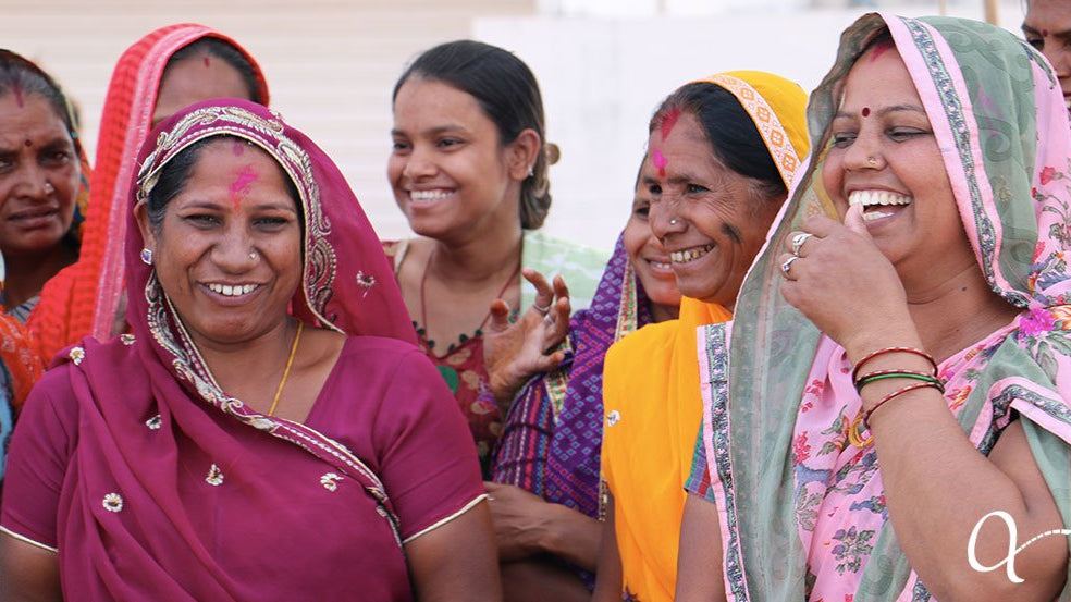 Group of artisan women joyfully laughing and smiling