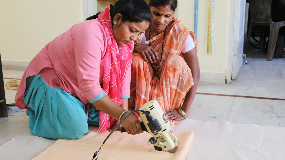 Anchal artisans using the new electric fabric cutter provided to them from incredible fundraising support