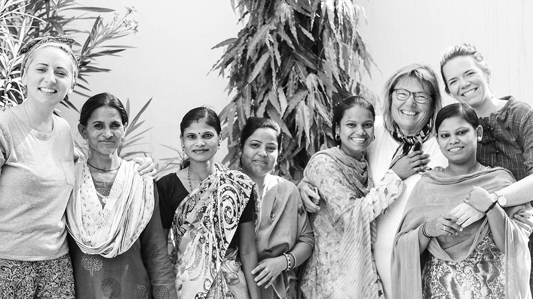 Colleen and Maggie Clines gathered together with some of Anchal's artisans from their last trip to India