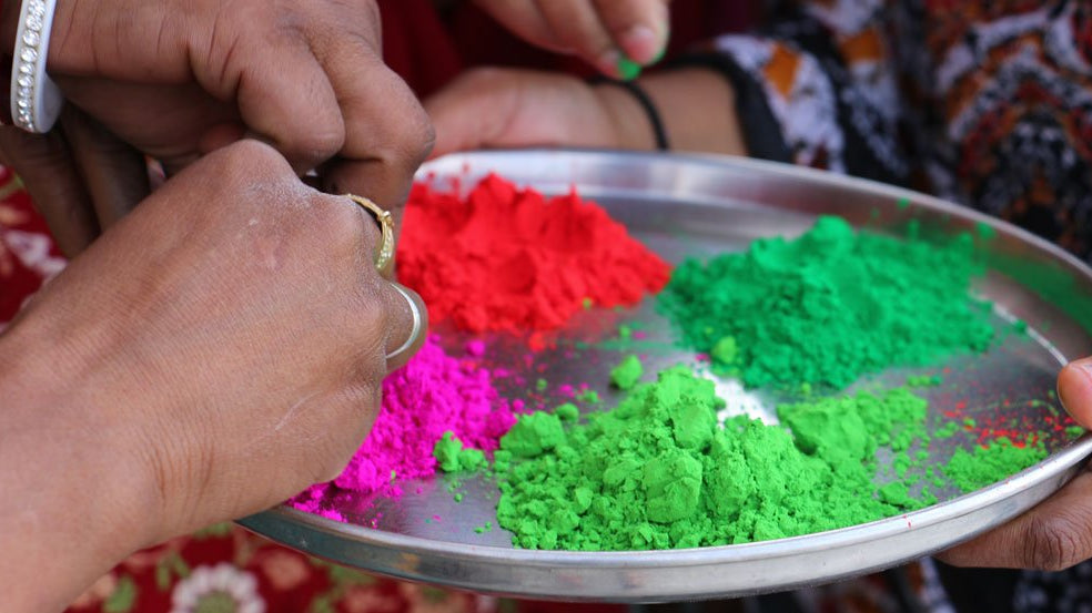 Pink, lime green, red, and dark green powder used for traditional celebrations of Holi