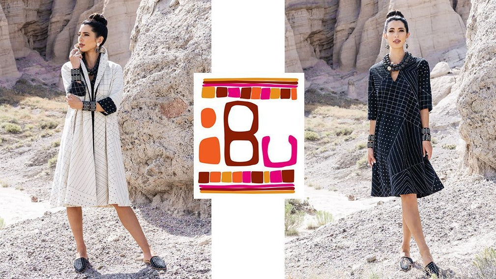 Pieces from Anchal's collaboration with IBU being modeled, featuring a hand stitched dress and coordinating shawl jacket