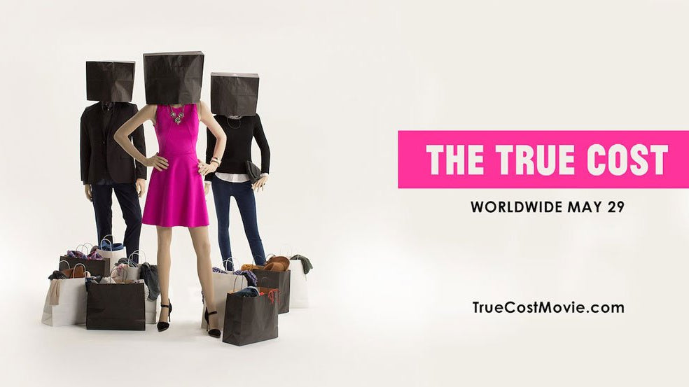 The cover for the documentary, The True Cost. 3 people with shopping bags over their heads surrounded by shopping bags full of clothing