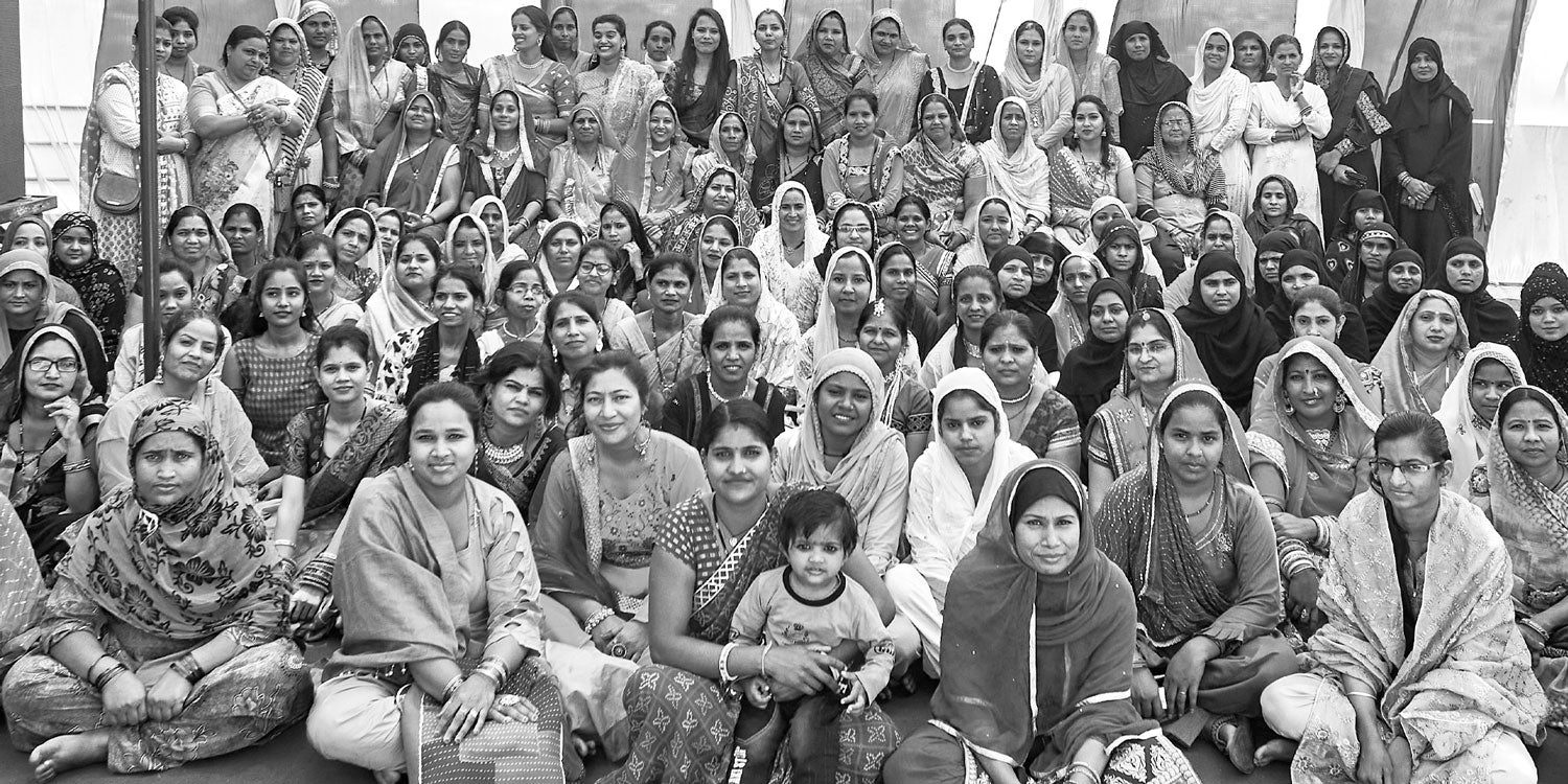 large group of Anchal artisans in India in black and white