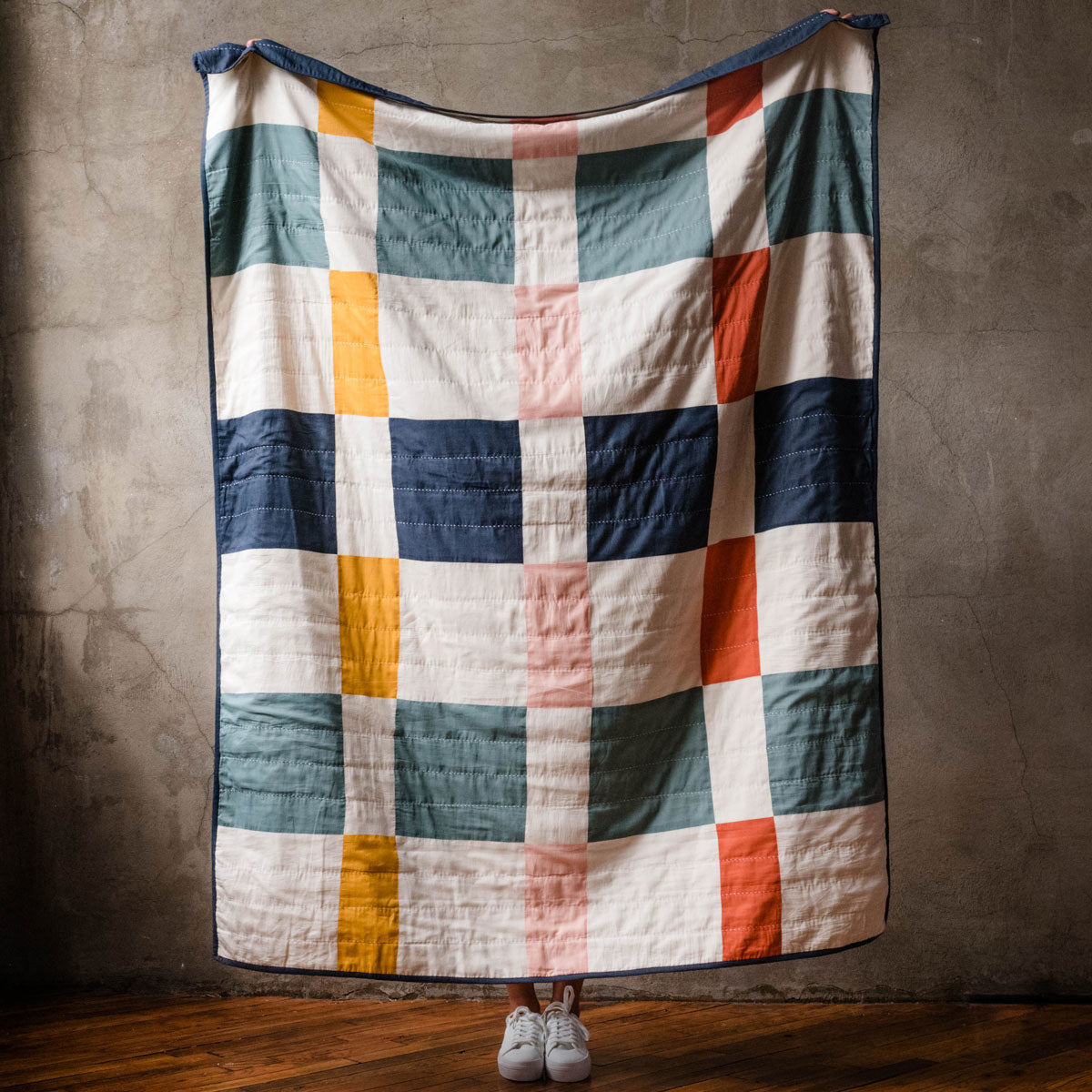 Bloomingdale's x Anchal collaboration, photo of a modern patchwork colorful quilt handmade in India