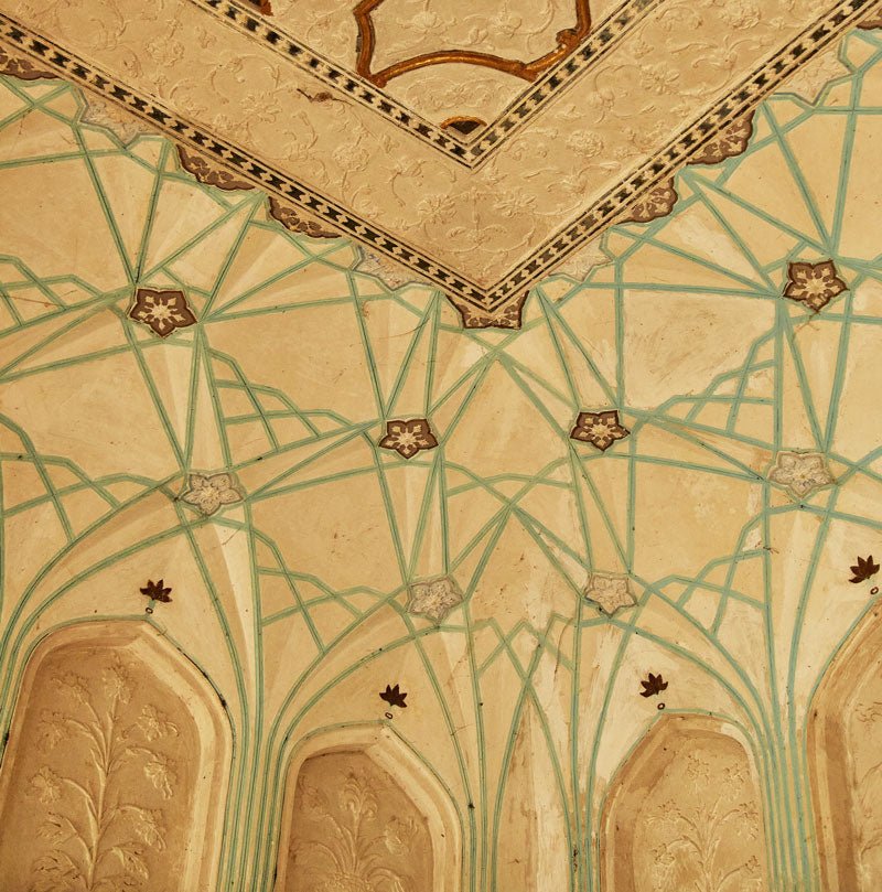 Decorative ceiling with geometric patterns and floral designs in India