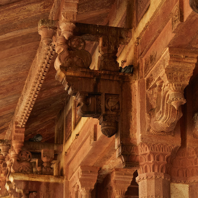 intricate carved columns in Indian architecture