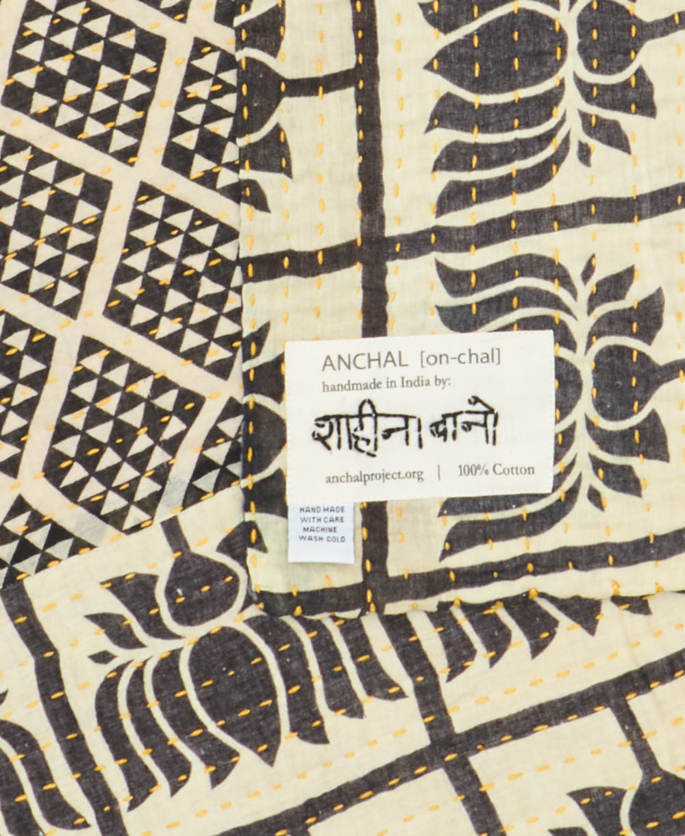 small kantha blanketwith signature of the maker on the tag