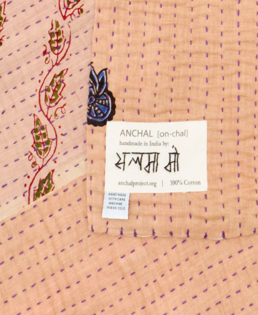 small kantha blanketwith signature of the maker on the tag