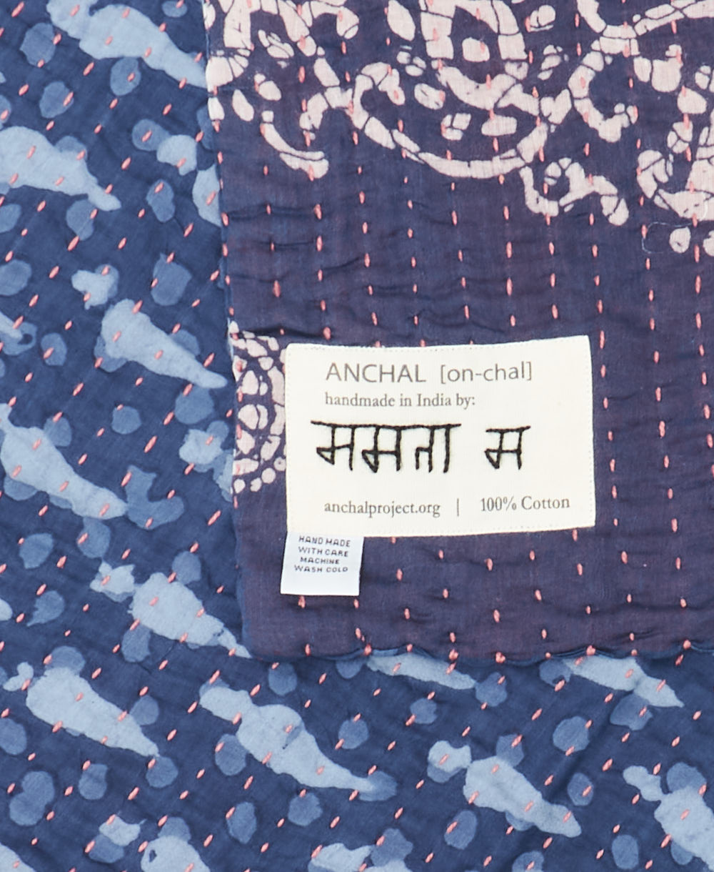small kantha blanket with signature of the maker on the tag