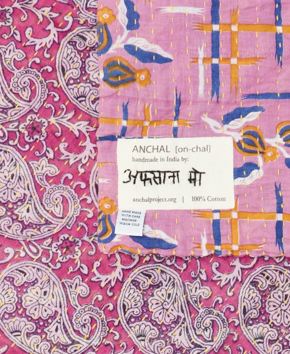 small kantha blanket with signature of the maker on the tag