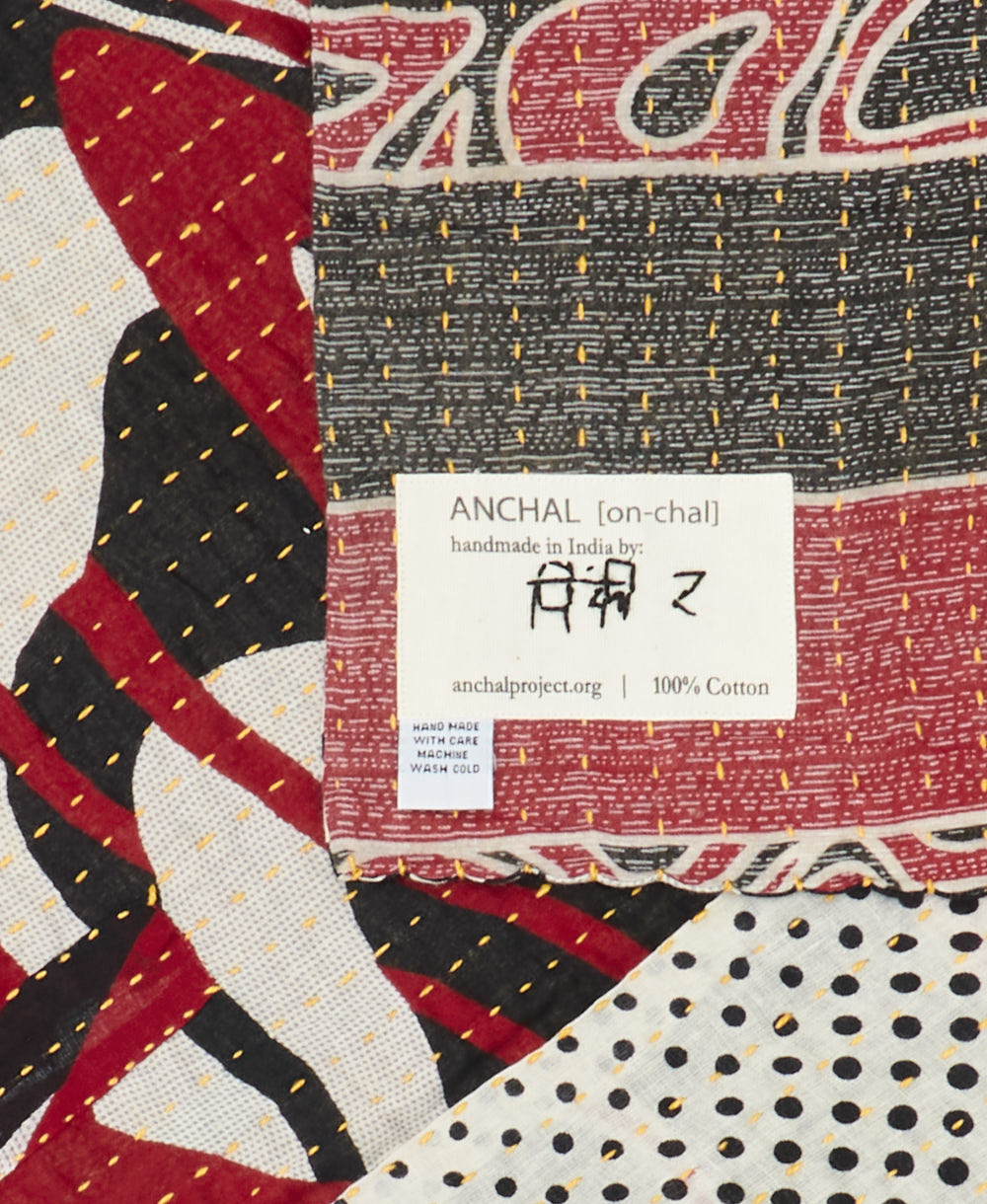 small kantha blanket with signature of the maker on the tag
