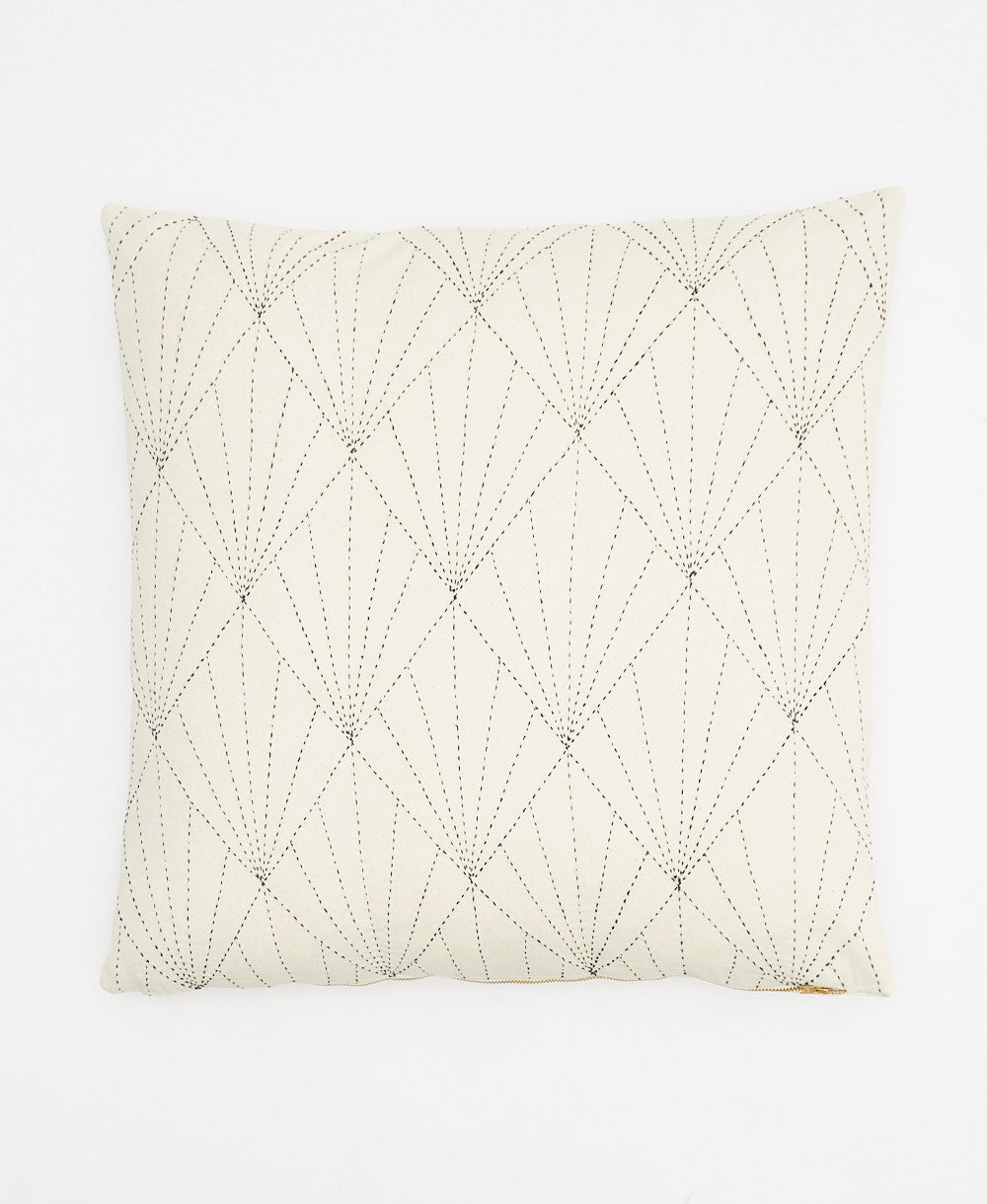 off-white modern throw pillow with black embroidery in an art deco fan pattern