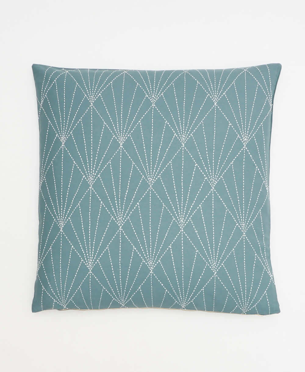 spruce green array throw pillow with white hand-stitched embroidery in an art deco fan pattern