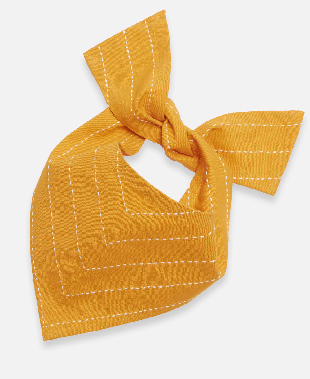 large mustard yellow dog bandana with white hand-stitched embroidery