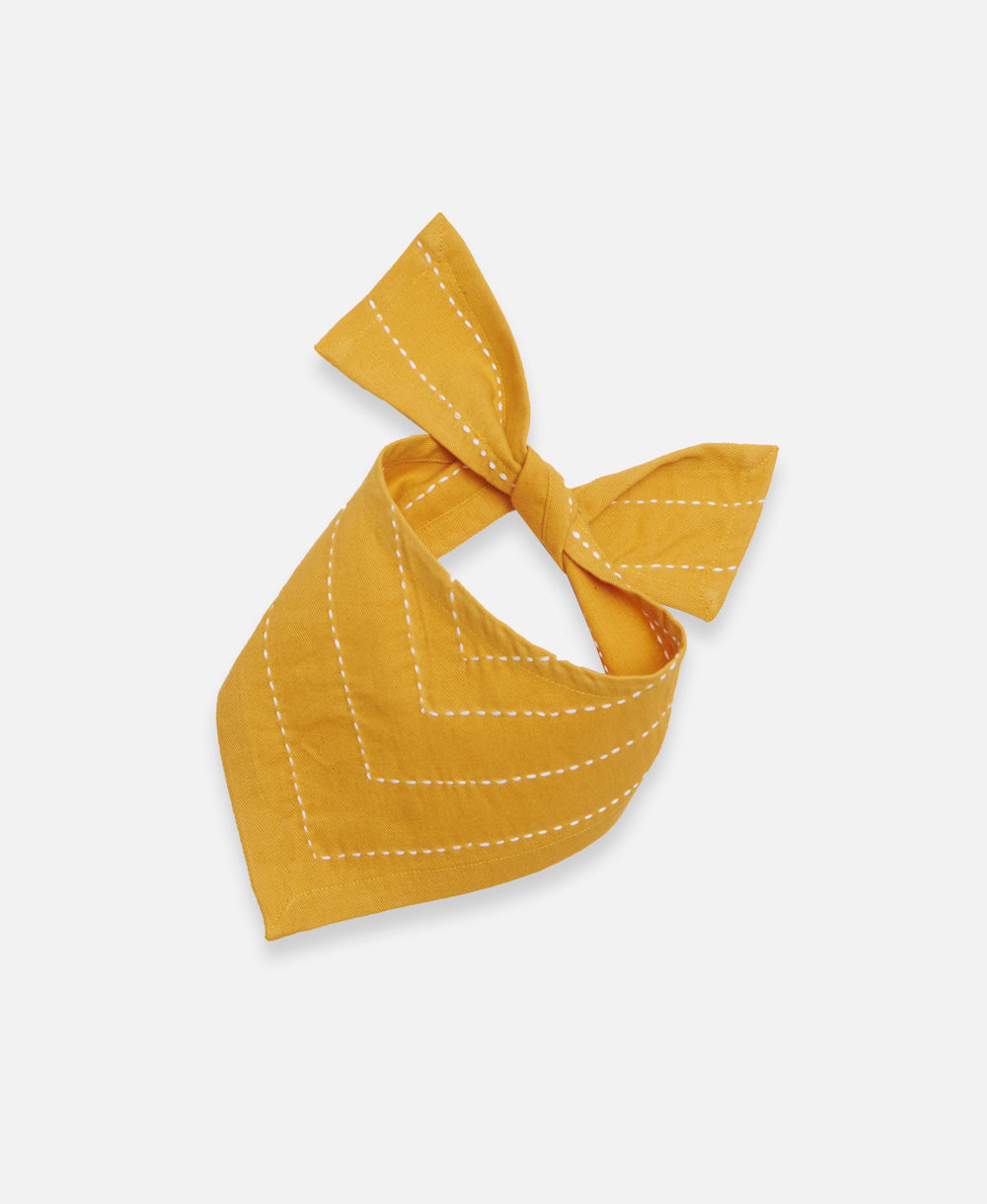 small mustard yellow dog bandana handmade in India by women artisans with white embroidery