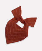medium rust red dog bandana with white hand-stitched embroidery