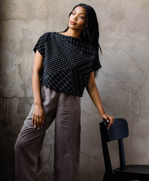 boxy structured crop top with abstract modern embroidery in charcoal black