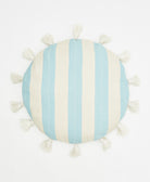Round pillow with blue and white striped pattern and tassels on a white background
