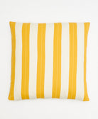 Striped pillow with yellow and white vertical stripes on a white background