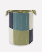 Fabric storage bin with green, blue, and beige color block design on a white background