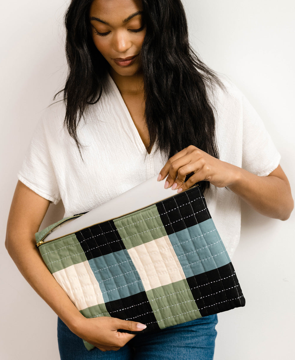 sage green checkered laptop case in 2 different sizes for different laptop sizes