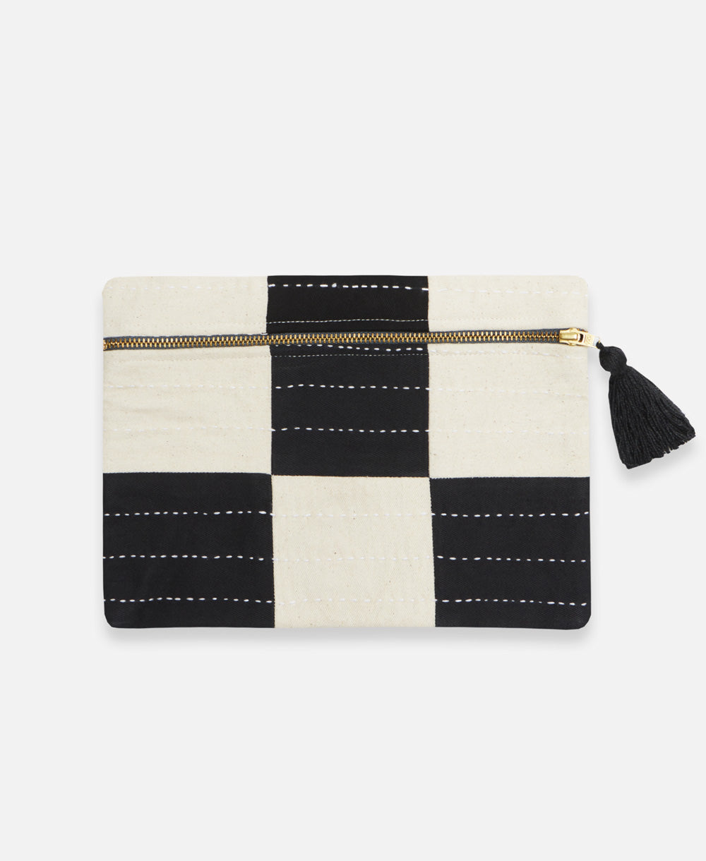 black and white checkered pouch clutch handmade in India complete with a black tassel and white embroidery