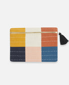 small checkered pouch in orange, mustard yellow, bone, pink, navy blue and cobalt blue with a black tassel