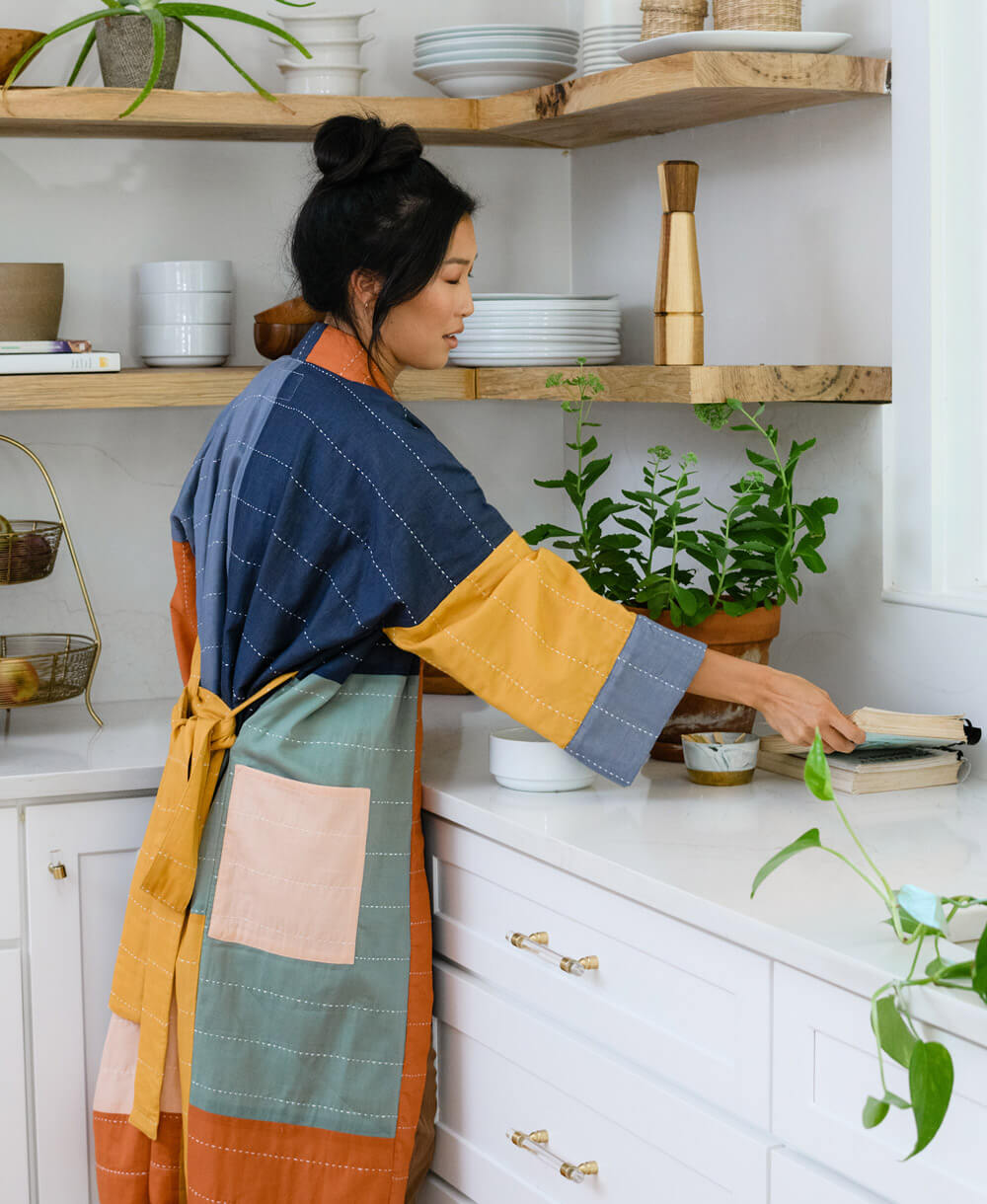 woman wearing colorblock robe handmade in India by women artisans
