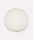 Round white pillow on a white background