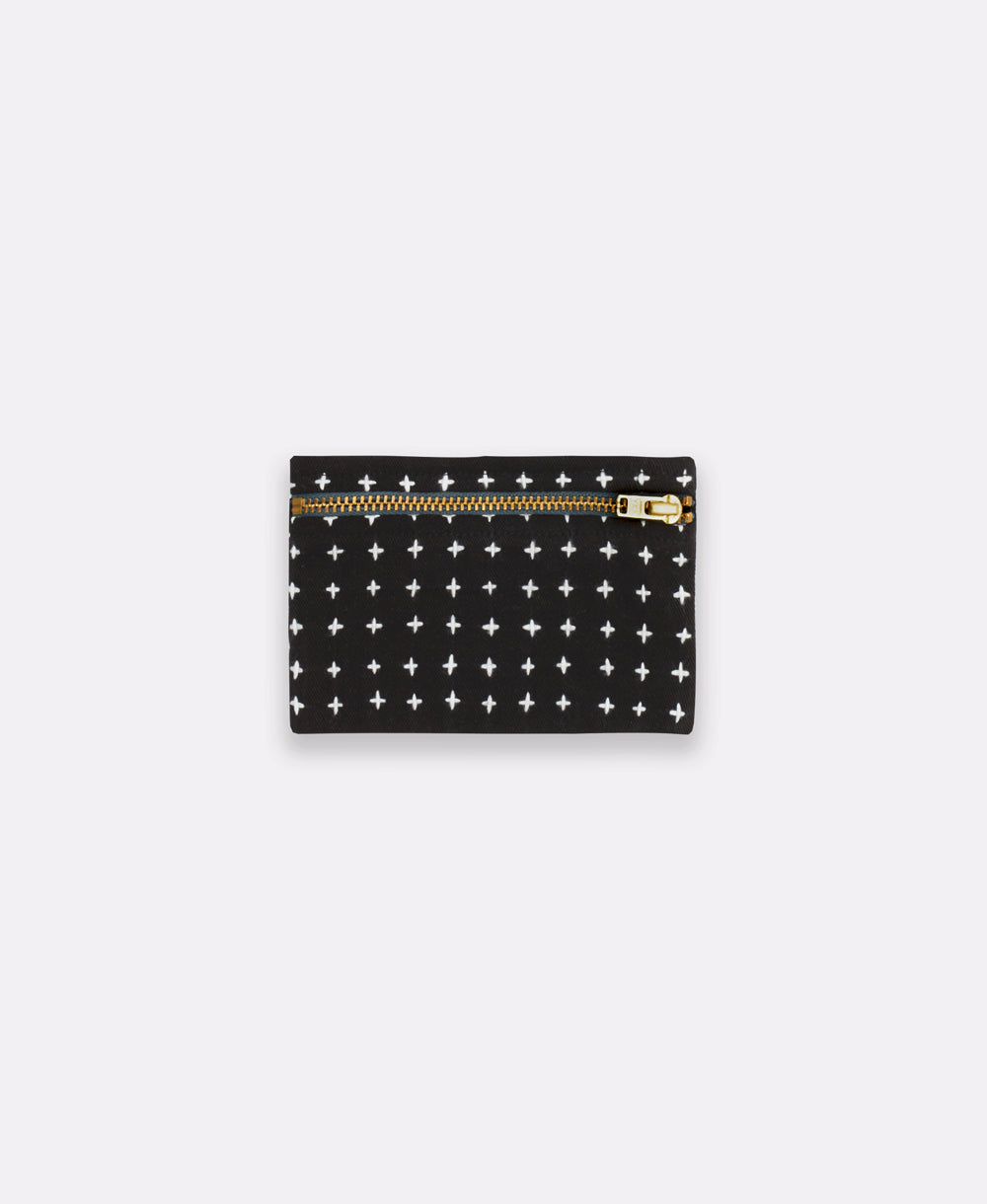 Black wallet with star pattern and gold zipper on a white background