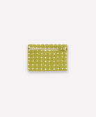 green coin purse with white cross-stitch pattern handmade in India
