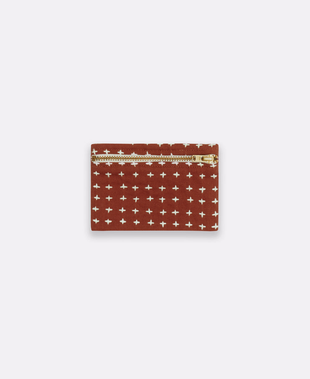 pink cross-stitch coin purse made from 100% organic cotton in India