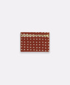 pink cross-stitch coin purse made from 100% organic cotton in India