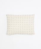 rectangular pillow in white with black cross-stitch embroidery
