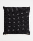 black throw pillow with white cross-stitch embroidery handmade in India from organic cotton