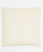 Beige pillow on a white background