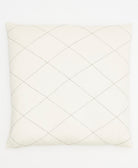 Quilted pillow with diamond pattern on a white background