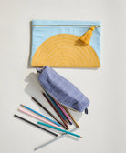 cloud blue and mustard yellow zippered pouch with grid-stitch pencil case in slate blue