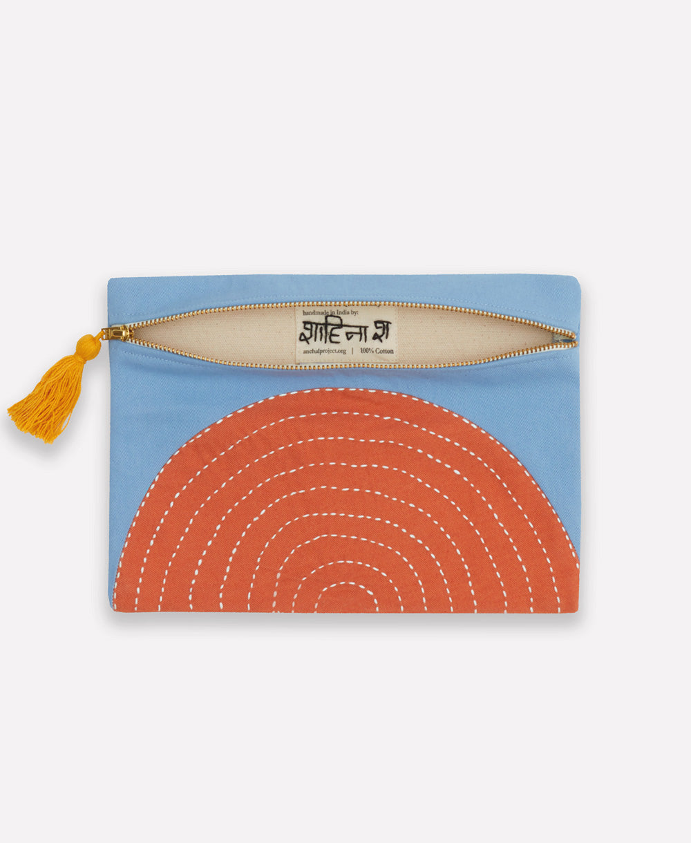 handmade pouch clutch lined with canvas with zipper closure and mustard yellow tassel pull