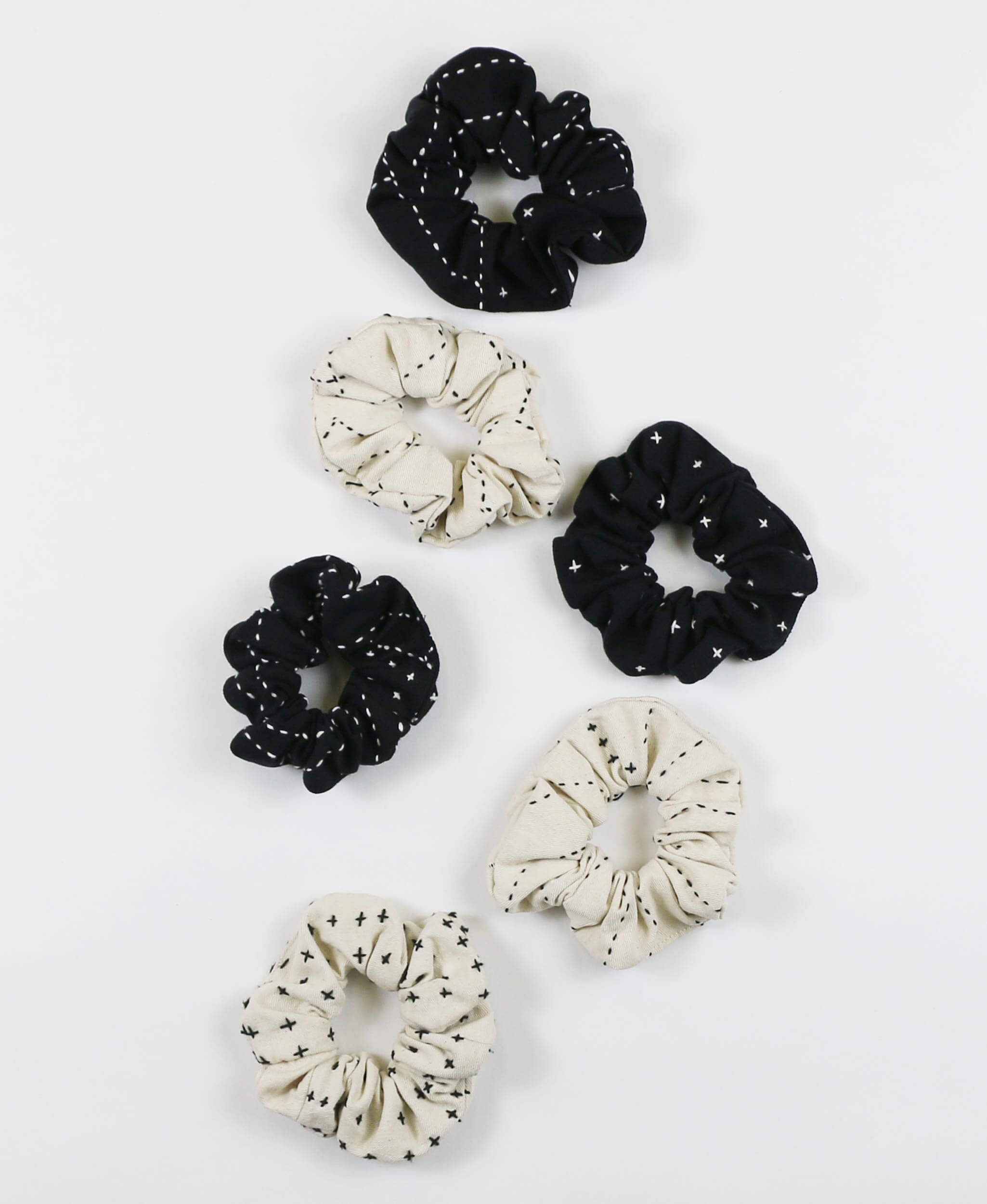 black and white organic cotton scrunchies with hand-embroidery handmade by women artisans in India