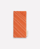 orange glasses case with white hand-stitched embroidery
