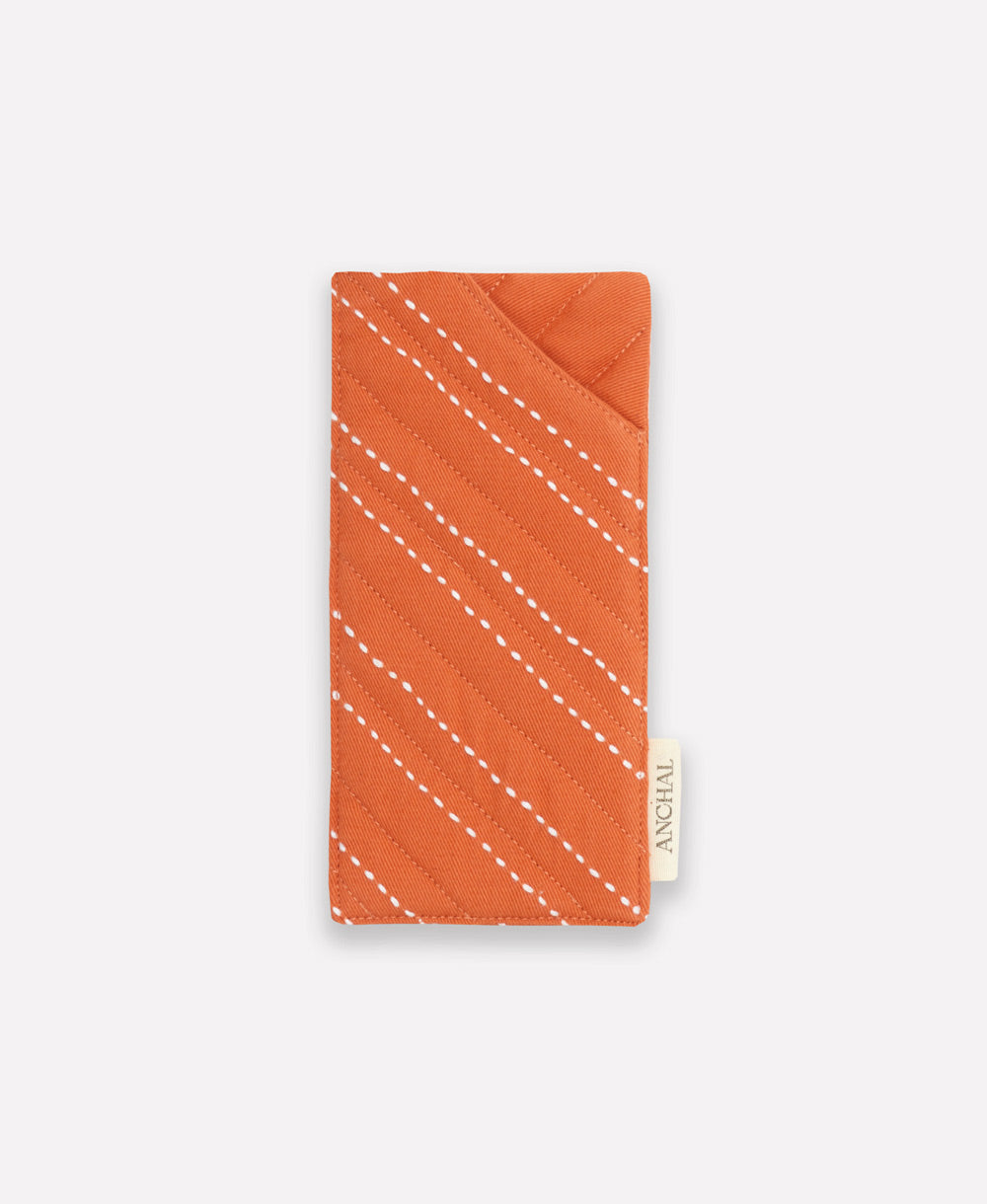 orange glasses case with white hand-stitched embroidery