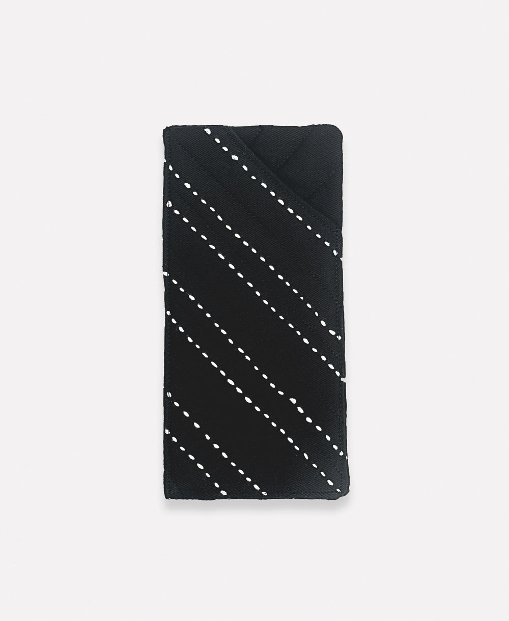 charcoal black glasses case with white hand-stitched embroidery
