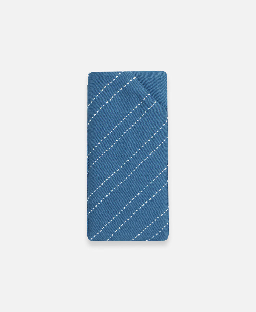 cobalt blue glasses case with white hand-stitched embroidery