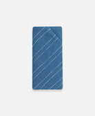 cobalt blue glasses case with white hand-stitched embroidery