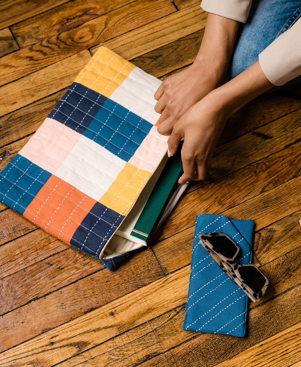 cobalt blue glasses case with matching checkered laptop case